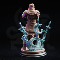 Felix Droste Graduate Battlemage 32mm resin miniature — rear view digital render showing detailed back armour, layered robes with embossed scrollwork, and the full arc of three translucent force blade conjurations wreathing the base in swirling magical energy