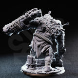 Rear view of the unpainted grey resin Ettin Brute miniature Flim and Krim, showing the broad matted back, ragged tattered cloth, the overhead club swing from behind, and the detailed rubble base with broken column fragments