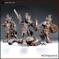 Three Novaminis goblin warrior sculpts standing with sword and shields alongside a fourth lying face-down on the ground, clawed hands splayed, feathered mohawk still raised, wearing riveted armour and an ornate belt.