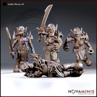 Four goblin warrior sculpts by Novaminis: one holding a short sword at rest, one raising a broad falchion overhead, one lunging forward with clawed hands, and one lying flat on the ground. All wear spiked shoulder armour and studded belts.