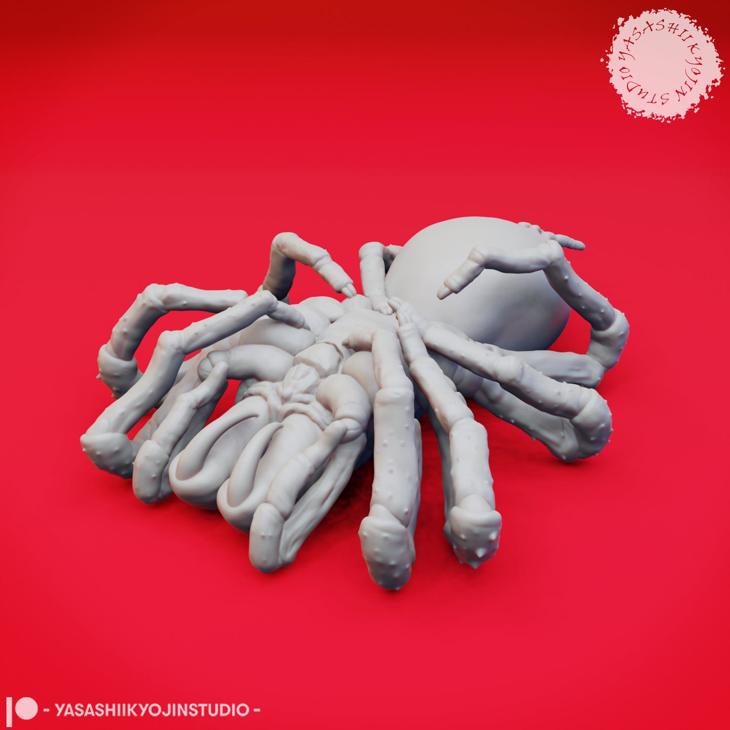 Unpainted grey resin giant spider miniature from above, showing eight segmented legs spread wide and a large smooth abdomen, sculpted by Yasashii Kyojin Studio