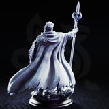 Glydnos by DM Stash — elven spellsword with swept-back hair and pointed ears, layered armour with star-motif belt buckle, billowing cloak, crescent staff raised, crystal rubble base.