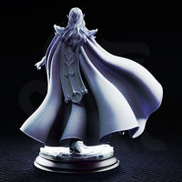 Glynaria drow priestess miniature in a three-quarter stance, angular elven armour with crescent detailing, flowing layered robes with naturalistic folds sweeping to one side, loose hair over shoulders, scenic swirling base. DM Stash.