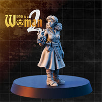 Gnome wizard miniature cradling conjured flame in one raised hand, wearing an embroidered long coat, buckled boots, and loose curly hair tied with a headband. Sculpt by DnD is a Woman.