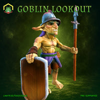 Muscular goblin miniature crouching mid-stride, gripping a tall spear in one hand and a riveted wooden shield in the other, wearing a dented metal helm with a purple cloth drape, bare-chested with leather bracers, teeth bared in a snarl. Sculpt by The Toadstool Weaver.
