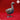 Grey resin digital render of a goose miniature by Yasashii Kyojin Studio, standing alert with neck extended, detailed feather texturing on wings and body, webbed feet visible, shown against a red background