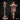 Digital render of the Gothic Garden Lamppost miniature showing the full piece from two angles — a tall rope-wound post topped with a latticed lantern head with swept pagoda-style roof, mounted on a cobblestone base overgrown with crystal formations and wild grass, shown in unpainted grey resin render