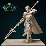 Digital render of Savine, a half-elf fighter miniature, shown from the front. She wears layered plate armour with pauldrons, a corset breastplate over chainmail, and a flowing cape. Her right arm raises a long twisted-grip greatsword diagonally across her body. Her hair is styled in a braided crown. The sculpt is shown in cream white against a dark teal background.