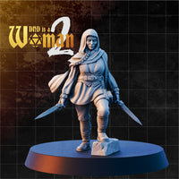 Halfling rogue with hood and braid, both shortswords drawn wide, smirking, wearing layered tunic, travel cloak and bracers, one knee raised over a cobblestone base. Sculpt by DnD Is A Woman.