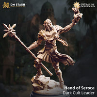 Digital render of the Hand of Seroca miniature — an armoured elven cult leader in a wide dynamic stance, holding a sun-star staff in one hand and conjuring swirling flame in the other, wearing a masked helm, layered scale-and-plate armour, and patterned skirts, mounted on a rocky terrain base. DM Stash Elves of the Golden Sun collection.