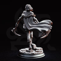 Hera the Blood Rogue by DM Stash, striding forward with twin curved hand-axes held low, wearing layered leather armour with engraved pauldrons and a billowing cape. Rubble base.