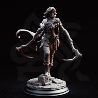 Hera the Blood Rogue by DM Stash, both ornate hand-axes extended wide in a combat stance, filigree pauldrons and laced corset visible, cape swept back, standing on a rocky rubble base.