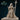 Hooded hexblood cleric holding a tall cross-tipped staff in one hand, fingers of the other hand raised mid-cast, wearing pentagram-buckled belt and moon-symbol tabard over a laced corset bodice. Sculpt by DnD Is A Woman.