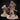 Two unpainted resin miniatures of the Holy Sister Purifier by Mia Kay M3DM — the larger front figure shows a robed woman with long loose hair holding a banded staff with a coiled whip; the smaller rear figure shows the same character in a hooded variant with face obscured; both stand on textured bases with crystalline growths