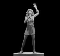 Female bard sculpt holding a microphone at chest height, one hand raised open to the sky, wavy shoulder-length hair, wrapped short skirt, standing upright mid-performance. By MZ4250.