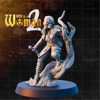 Female human ranger braced against a gnarled dead tree trunk, drawing a longbow, with a small owl companion perched at her chest. Leather and scale armour, loose long hair. Sculpt by DnD is a Woman.