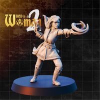 Female human sorcerer in a wide combat stance, one arm extended forward with coiling arcane energy spiralling from her hand, the other drawn back near her chest. Belted tunic with chain-link trim, lace-up boots, long hair swept back. Sculpt by DnD Is A Woman.