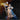 Full-length female wizard sculpt standing upright, holding a tall twisted staff in her right hand, left hand on hip. Long layered gown with laced corset bodice, puffed sleeves, and turban-style hair wrap. Sculpt by DnD is a Woman.