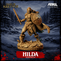 Hilda Barbarian 32mm miniature by Primal Collectibles — front-facing charging pose, sword raised, skull-bossed round wooden shield, fur-trimmed boots, tattered cloak, screaming expression, scenic base with skulls and rubble, golden resin render