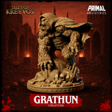 Grathun miniature from the left side, showing the full sweep of the tattered cloak, thick fur-covered arms reaching forward, skulls and broken masonry arranged across the decorative base. By Primal Collectibles.