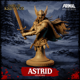 Front view of Astrid Valkyrie display bust — unpainted gold resin render showing winged helm, battle roar expression, sword thrust forward in two hands, feathered cloak, segmented belt and faulds, on a studded circular stone base. Snowy mountain backdrop.