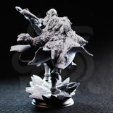Unpainted grey resin miniature of Ice Heart by DM Stash — rear view showing richly textured fur cloak detail, flowing cape, and the jagged ice shard scenic base erupting beneath her feet