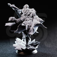 Unpainted grey resin miniature of Ice Heart by DM Stash — rear view showing richly textured fur cloak detail, flowing cape, and the jagged ice shard scenic base erupting beneath her feet