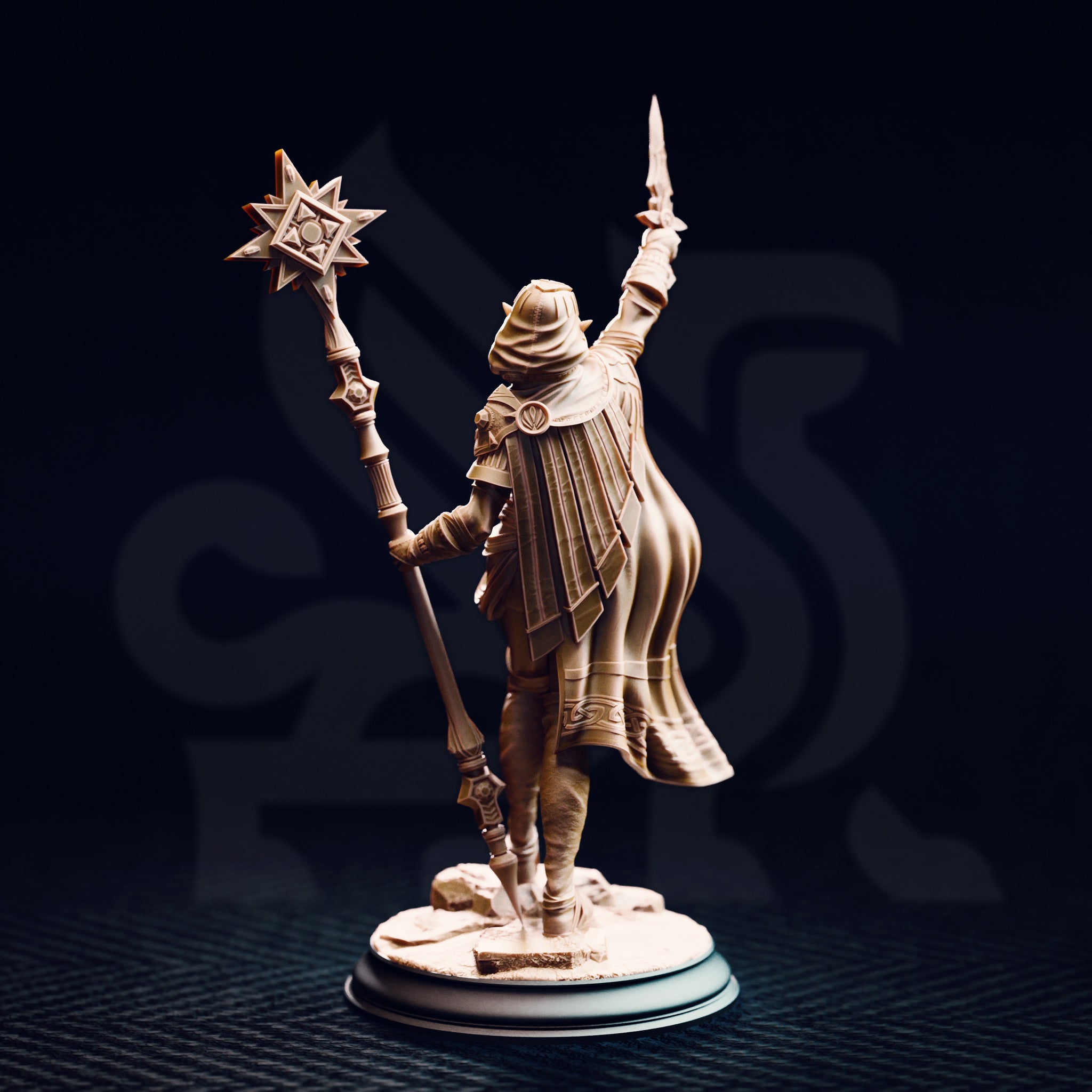 Unpainted resin miniature of Ilisyia the desert elf priestess, rear view. Shows the full-length flowing cape with panelled pleating, rear armour detailing including a circular embossed medallion at the shoulder, and the ornate shaft of her solar mace. Desert rubble base detail visible at foot level.