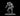 Grey resin unpainted digital render of the MZ4250 Iron Golem variation 2 miniature — a heavily armoured construct in a forward-crouching combat stance, gripping a shortsword low in its right hand with left fist clenched, wearing full segmented plate armour with angular pauldrons and a stern visored helm, mounted on a flat oval base