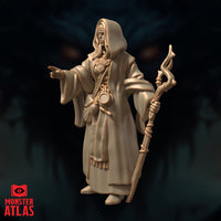 Three-quarter angle digital render of Jallarzi Sallavarian miniature showing the side profile of her layered robes, rope-wound staff, and extended pointing hand, with detail visible on her belt accessories and hooded cloak, unpainted warm beige resin finish by Monster Atlas