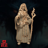 Close-up front digital render of Jallarzi Sallavarian miniature emphasising facial detail — sharp focused expression beneath a cloth headband, long hair framing the face, ornate brooch on chest clearly visible, staff held to one side and right hand reaching forward, unpainted warm beige resin finish by Monster Atlas