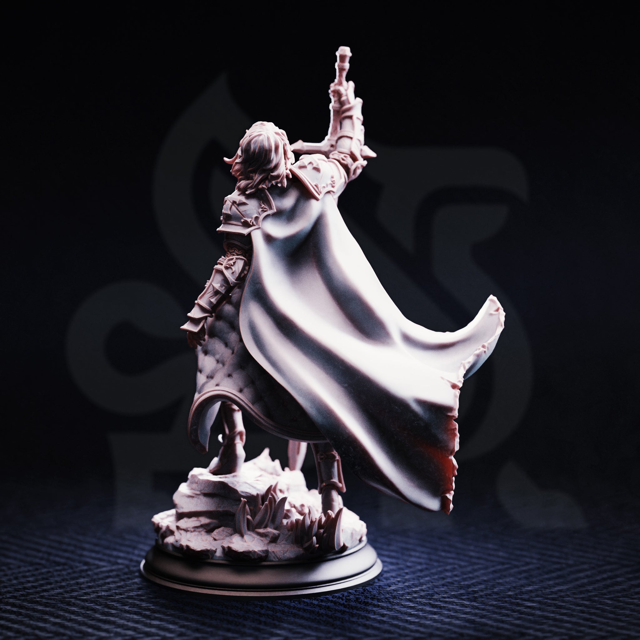 Rear view of the unpainted grey resin Jeanne du Lac miniature, highlighting the dramatic sweep of her cape billowing outward and the detailed quilted and plated back armour, with the scenic base visible below.