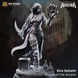 Digital render of Kira Solseth Rogue of the Arcane miniature by DM Stash — unpainted grey resin, mid-stride pose with curved blade in right hand and flaming arcane orb in raised left hand, wearing buckled leather armour and billowing coat, on a scenic base with crate, potions, and scroll