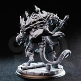 Rear three-quarter view of the DM Stash Rat King resin miniature — showing spiked back with protruding blades, a long rat tail, heavy armoured torso, and broken stone base with scattered cannon debris