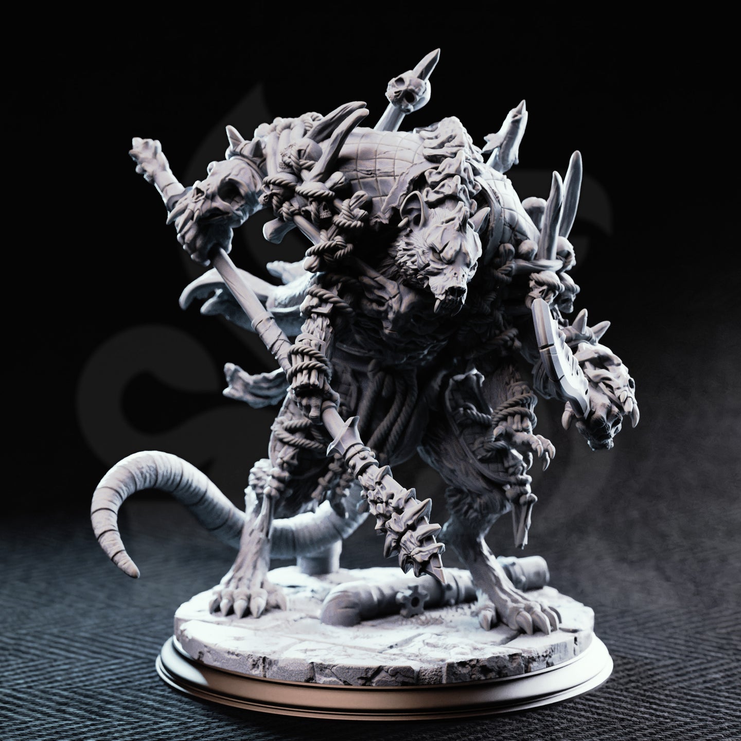 Unpainted grey resin Rat King miniature by DM Stash — front view showing multiple snarling rat heads, looted weapons including a skull-tipped staff, thick ringed tail, and layered scale-and-fur textures on a detailed rubble base