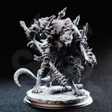 Unpainted grey resin Rat King miniature by DM Stash — front view showing multiple snarling rat heads, looted weapons including a skull-tipped staff, thick ringed tail, and layered scale-and-fur textures on a detailed rubble base