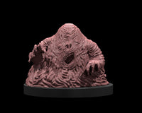 32mm scale resin miniature of a D&D lemure — a hunched, grotesque mass of rippling corrupted flesh on an oval base, with a slack-jawed face, sealed eyes, and one clawed arm raised. Unpainted digital render shown in pink-grey resin.