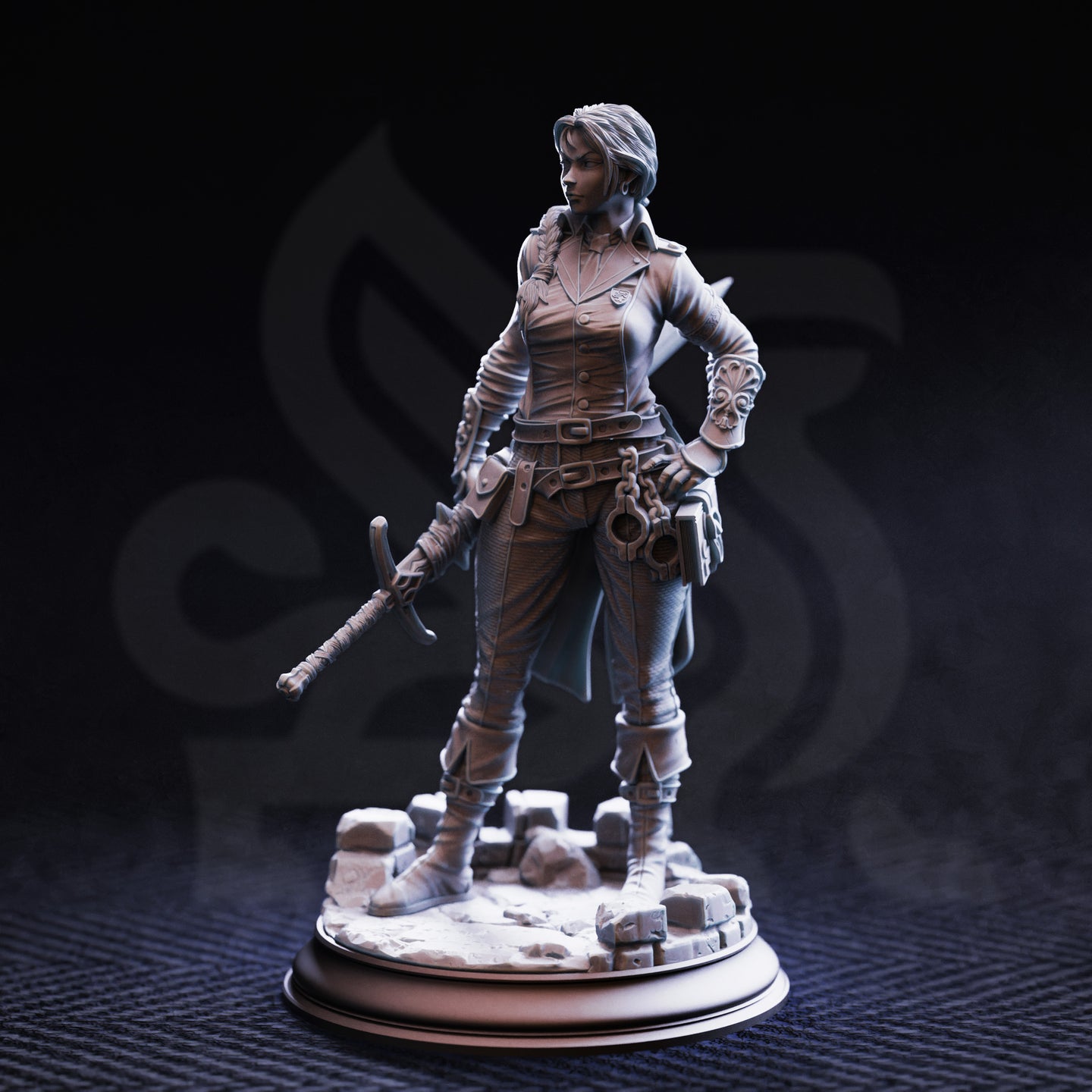 Photograph of the unpainted grey resin Lieutenant Gwendolen Proud miniature from the front — detailed female figure in layered coat and buckled straps, braided hair, ornate bracer, manacles at hip, short sword in hand, posed on a circular rubble-strewn cobblestone base.