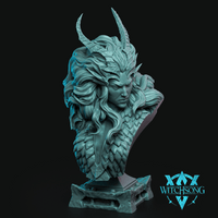 Digital render of the Lilith bust by Witchsong Miniatures, shown in teal resin. The bust depicts a fierce horned female figure with sweeping curved horns, flowing wind-swept hair interwoven with dragon scales, and interlocking scale armour across the shoulders and chest. Her expression is intense and commanding. The piece sits on a carved gothic stone plinth base. The Witchsong Miniatures logo is visible in the lower right corner.
