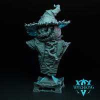 Digital render of the Lord of the Harvest bust by Witchsong Miniatures — an unpainted grey resin display bust showing a pumpkin-headed figure with a carved leering face, ragged wide-brimmed hat, gnarled vines across the chest, and a tattered cracked coat, mounted on a squared rocky pedestal base, shown against a dark background