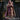 Lune de la Rue Student of the Magical Arts 32mm resin miniature by DM Stash — digital render showing a young female mage in a flowing academic cloak and layered skirt, raising a small flame of arcane fire in her right hand, with keys and a chain at her belt and a tome-inscribed flagstone base