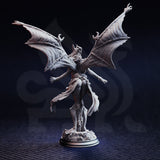 Unpainted grey resin miniature of Luxuria of the Second photographed from the rear, showing the full spread of her veined bat wings, flowing cloth garments, and detailed textured base — highlights the quality of the back-of-sculpt detail