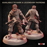 Digital render showing front and back views of an unpainted male human barbarian miniature — broad-shouldered with cloth wrappings, a full beard, and a bone club, posed mid-stride on a scenic desert base with scattered rocks, scrub plants, and a ram's skull