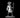 Male medusa miniature standing upright, holding a tall heart-topped staff in one hand and manifesting ghostly flame in the other, with a crown of writhing snakes in place of hair. Sculpt by MZ4250.