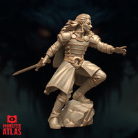 Unpainted resin miniature of Melf Prince Brightflame by Monster Atlas — three-quarter front-left view highlighting the flowing cape, riveted leather armour panels, and the dynamic lunging stance with sword lowered and arcane hand outstretched