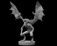 A winged mephit crouching low with both leathery wings spread wide, clawed feet gripping the base, mouth open in a snarl. Sculpt by MZ4250.