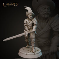 Front view of an unpainted grey resin miniature of a grizzled male mercenary, sculpted by Galaad Miniatures. He wears a feathered tricorne hat, slashed doublet, and partial plate armour with shoulder pauldrons. He holds a long sword lowered at his side in a ready stance. Mounted on a cobblestone round base. 32mm scale.