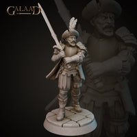 Front view of an unpainted grey resin miniature of a grizzled male mercenary at 32mm scale, wearing a broad-brimmed feathered hat, torso armour with pauldrons, and layered leather skirt, holding a longsword raised across his body in a guarded stance, with a scowling bearded expression, mounted on a cobblestone base — sculpted by Galaad Miniatures