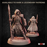 Digital render of the Metalforged Grave Cleric miniature showing front and rear views — a hooded construct in layered armour bearing an ankh on its breastplate, wielding a tall twisted spear-staff, with articulated mechanical limbs visible beneath a flowing cloak, mounted on a detailed rocky base at 32mm scale