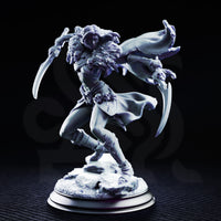 Drow female rogue mid-stride with twin curved blades extended wide, skull-adorned pauldrons, flowing hair, scaled billowing cloak, and skull belt details. Rocky scenic base. Sculpt by DM Stash.